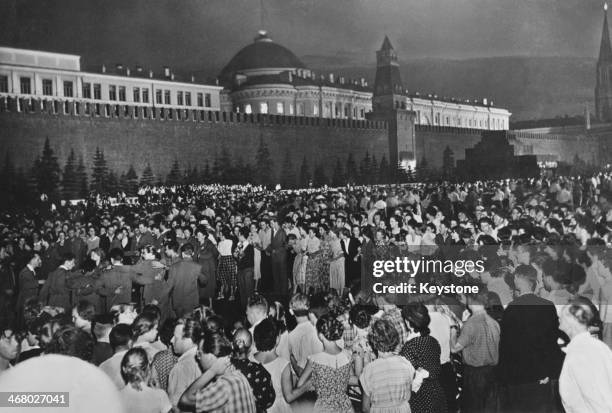 Crowds outside the Kremlin in Red Square on the opening night of the 6th World Festival of Youth and Students, Moscow, former Soviet Union, 30th July...
