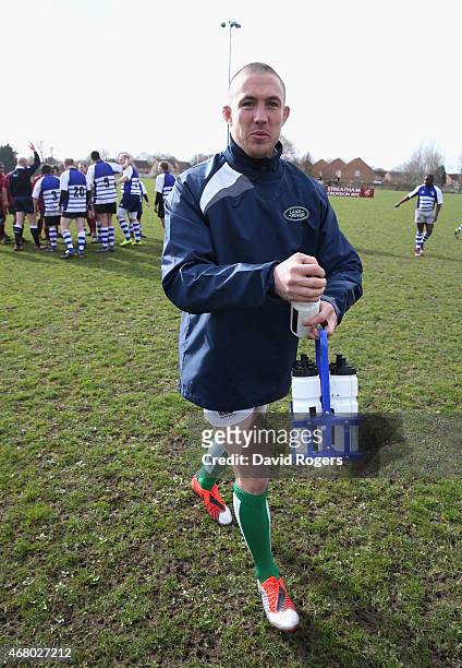 Land Rover ambassador Mike Brown carries the water bottles during the launch of the Land Rover Rugby World Cup 2015 "We Deal In Real" campaign at a...