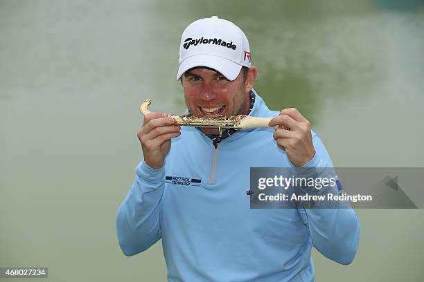 Richie Ramsay of Scotland poses with the trophy after winning the Trophee Hassan II Golf at Golf du Palais Royal on March 29, 2015 in Agadir, Morocco.