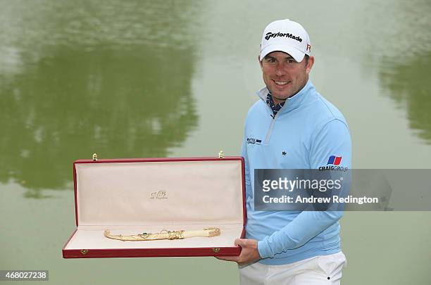 Richie Ramsay of Scotland poses with the trophy after winning the Trophee Hassan II Golf at Golf du Palais Royal on March 29, 2015 in Agadir, Morocco.