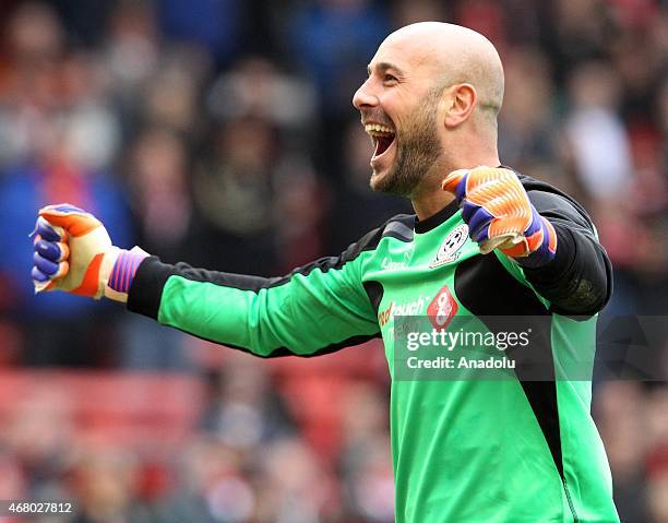 Team Carragher's goalkeeper Pepe Reina laughs after making a save during the Liverpool All-Star charity soccer match at Anfield stadium in Liverpool,...