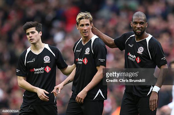 Ryan Babel of the Gerrard XI embraces team-mate Fernando Torres at full time following the Liverpool All-Star Charity match at Anfield on March 29,...