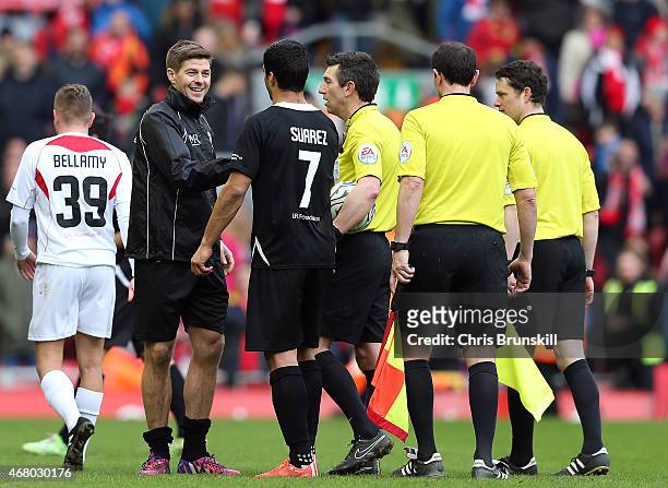 Luis Suarez and Steven Gerrard of the Gerrard XI shake hands at full time following the Liverpool All-Star Charity match at Anfield on March 29, 2015...