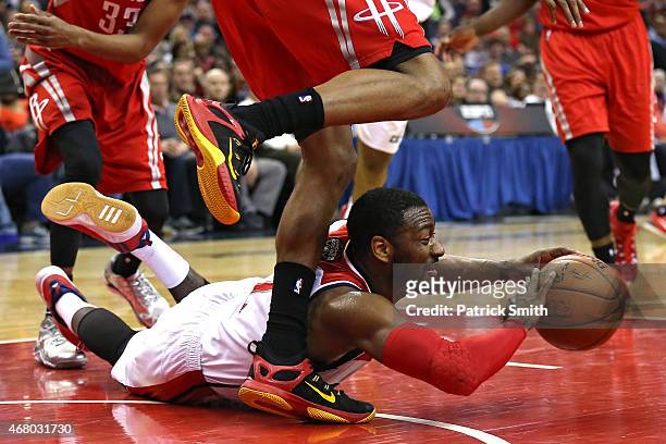 John Wall of the Washington Wizards looks to pass the ball against the Houston Rockets in the second half at Verizon Center on March 29, 2015 in...