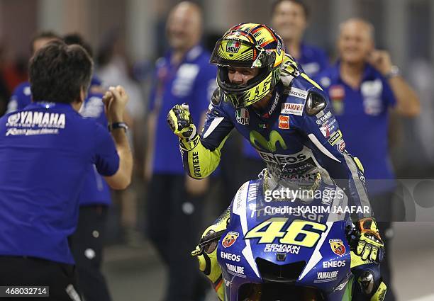 Italian MotoGP rider Valentino Rossi of the Movistar Yamaha team celebrates with teammates after winning the MotoGP race of the Qatar Grand Prix...