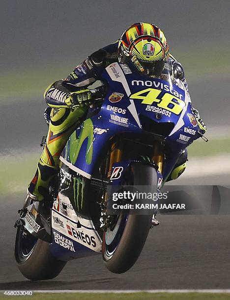 Italian MotoGP rider Valentino Rossi of the Movistar Yamaha team races during the MotoGP race of the Qatar Grand Prix Grand Prix on March 29, 2015 at...