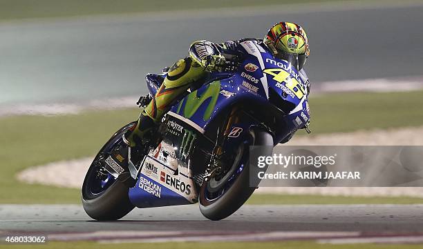 Italian MotoGP rider Valentino Rossi of the Movistar Yamaha team races during the MotoGP race of the Qatar Grand Prix Grand Prix on March 29, 2015 at...