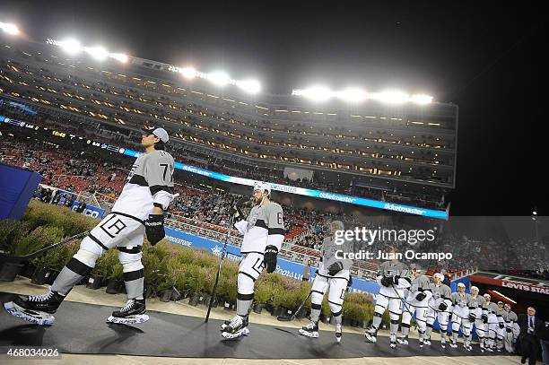 Jordan Nolan, Jake Muzzin, Brayden McNabb, Tyler Toffoli and their Los Angeles Kings teammates walk to the ice surface for warm-up prior to the 2015...