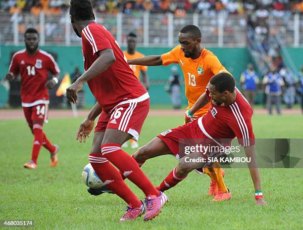 Equatorial Guinea's Fernando Rui Dangracia Armando Sipoto Banale vie with Ivory Coast's Jean-Daniel Akpa Akpro during the friendly football match...