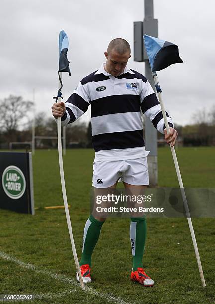 Land Rover ambassador Mike Brown puts out the corner flags during the launch of the Land Rover Rugby World Cup 2015 "We Deal In Real" campaign at a...