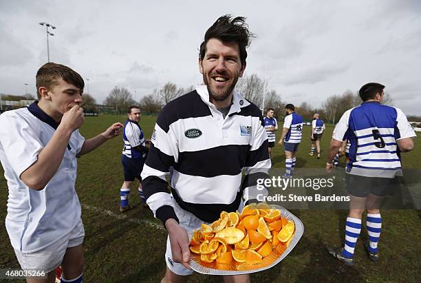 Former Ireland International Shane Horgan carries half time oranges onto the pitch during the launch of the Land Rover Rugby World Cup 2015 "We Deal...