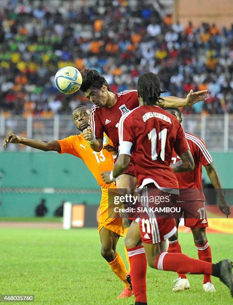 Equatorial Guinea's Carlos Akapo Martinez vies with Ivory Coast's Jean Daniel Akpa Akpro during the friendly football match Ivory Coast againt...