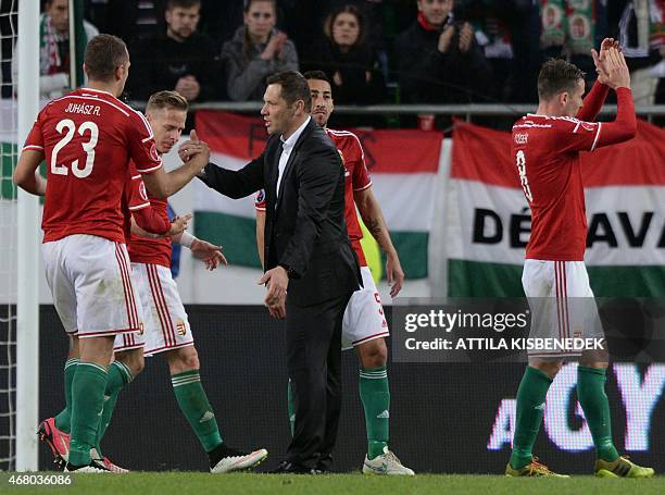 Hungary's coach Pal Dardai celebrates with his players after the Euro 2016 qualifying football match between Hungary and Greece at the Groupama Arena...