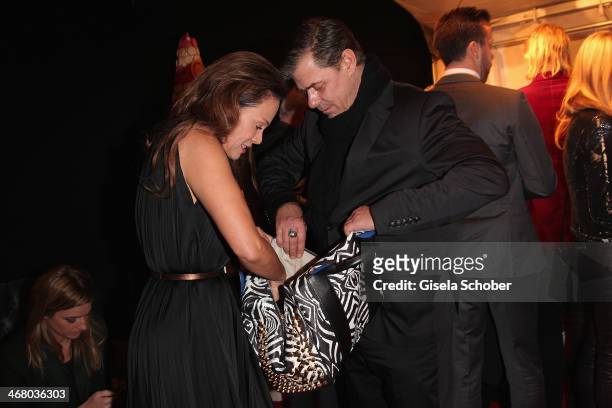 Sonja Kirchberger and Sven Martinek search in the handbag at the Bild 'Place to B' Party during the 64th Berlinale International Film Festival on...