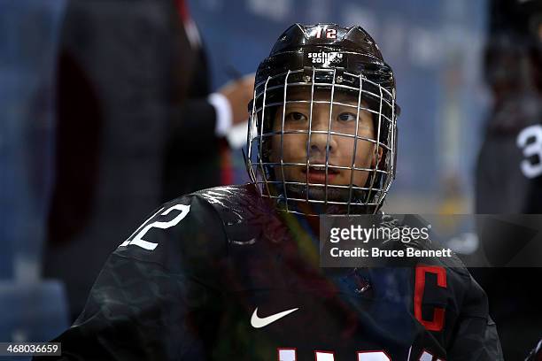Chiho Osawa of Japan looks on from the bench against Sweden during the Women's Ice Hockey Preliminary Round Group B Game on day two of the Sochi 2014...