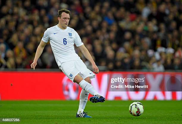 Phil Jones of England passes the ball during the EURO 2016 Qualifier match between England and Lithuania at Wembley Stadium on March 27, 2015 in...