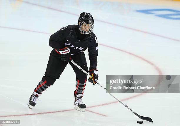 Sena Suzuki of Japan skates with the puck during the Women's Ice Hockey Preliminary Round Group B Game between Sweden and Japan on day 2 of the Sochi...