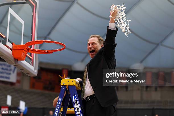 Head coach Tom Izzo of the Michigan State Spartans celebrates by cutting down the net after defeating the Louisville Cardinals 76 to 70 in overtime...