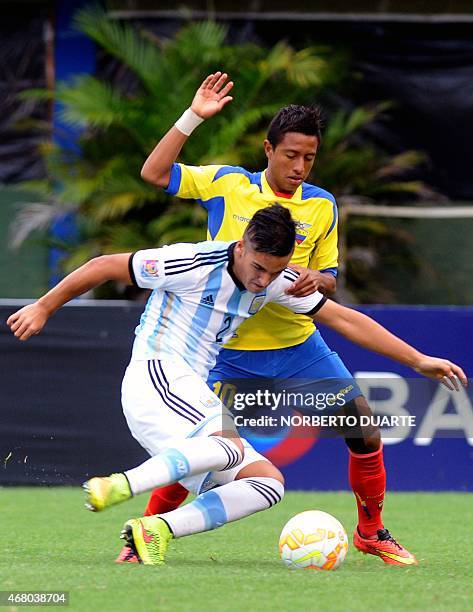 Julian Ferreyra of Argentina, and Fabiano Tello of Ecuador, vie for the ball during their U-17 South American final round football match at Feliciano...
