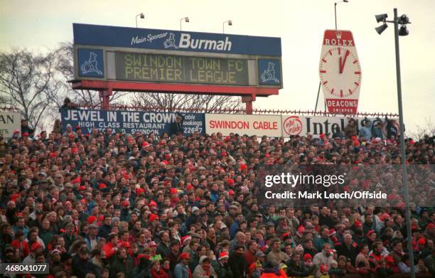 December 1993 Premier League Football - Swindon Town v Arsenal, Standing supporters are packed on the open terrace at the County Ground, where the...