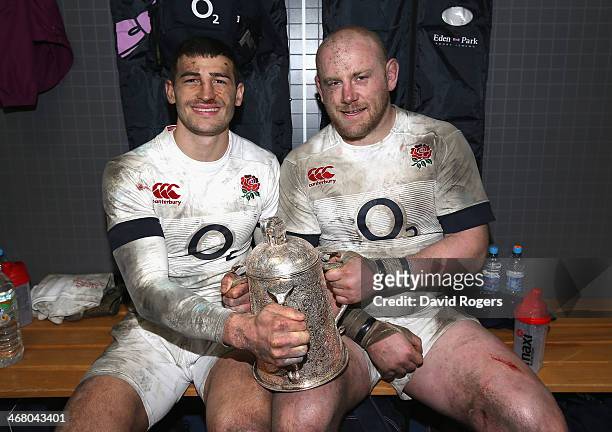 Jonny May and Dan Cole celebrate with the Calcutta Cup after their victory during the RBS Six Nations match between Scotland and England at...