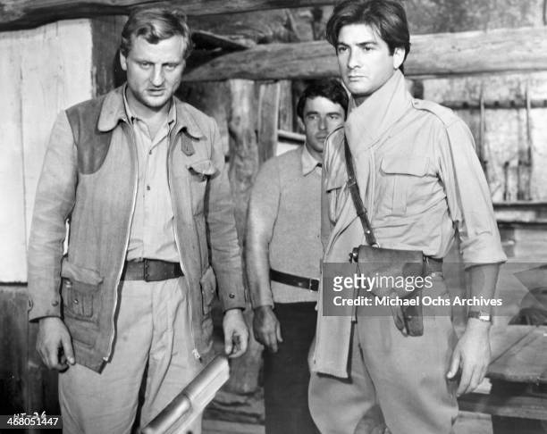 Actor Bruno Cremer, Jean-Claude Brialy and Gerard Blain on set of the movie "Shock Troops" , circa 1967.