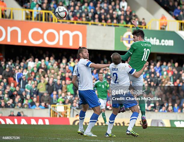 Kyle Lafferty of Northern Ireland scores with a header to make the score 2-0 during the EURO 2016 Group F qualifier at Windsor Park on March 29, 2015...