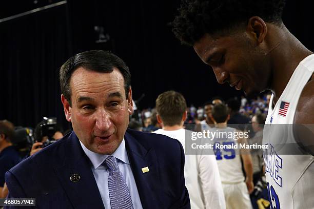 Head coach Mike Krzyzewski and Justise Winslow of the Duke Blue Devils speak on the court after defeating the Gonzaga Bulldogs 66-52 during the South...