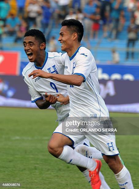 Honduras' Andy Najar celebrates with teammate Antony Lozano after scoring the team's second goal against French Guiana during the Concacaf Gold Cup...