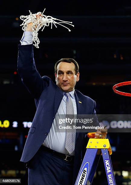 Head coach Mike Krzyzewski of the Duke Blue Devils cuts down the net after defeating the Gonzaga Bulldogs 66-52 in the South Regional Final of the...