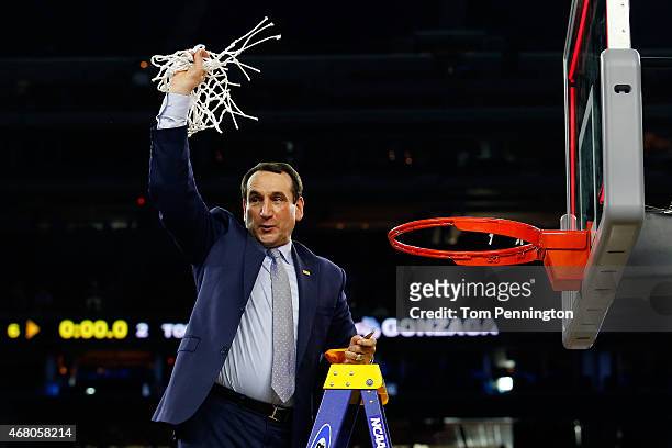 Head coach Mike Krzyzewski of the Duke Blue Devils cuts down the net after defeating the Gonzaga Bulldogs 66-52 in the South Regional Final of the...
