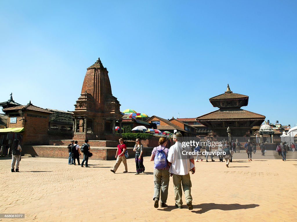 Tourists and residents walk on the place in Bhaktaput city.