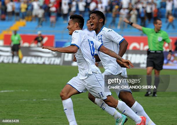 Honduras' Andy Najar celebrates with teammate Antony Lozano after scoring the team's second goal against French Guiana during the Concacaf Gold Cup...