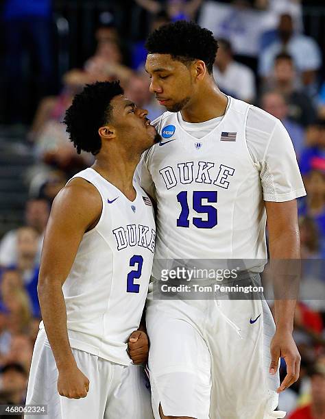Quinn Cook and Jahlil Okafor of the Duke Blue Devils celebrate in the second half against the Gonzaga Bulldogs during the South Regional Final of the...