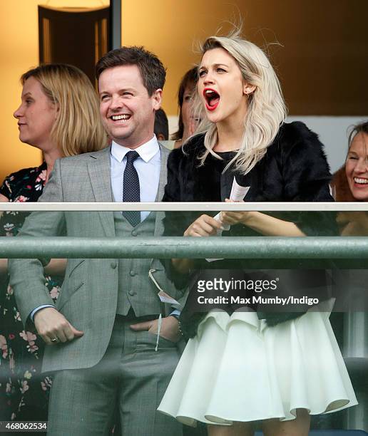 Declan Donnelly and Ashley Roberts watch the racing as they attend The Prince's Countryside Fund Raceday at Ascot Racecourse on March 29, 2015 in...