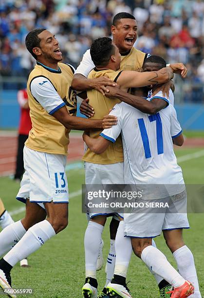 Honduras' players celebrate scoring against French Guiana during the Concacaf Gold Cup qualifying playoff match, at the Olimpico Metropolitano...