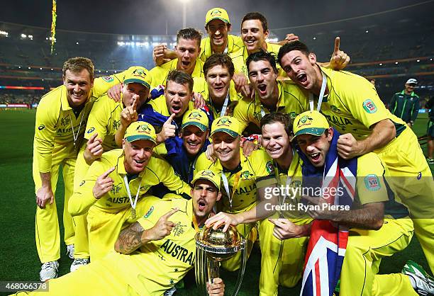 The Australian Team celebrate with the trophy after the 2015 ICC Cricket World Cup final match between Australia and New Zealand at Melbourne Cricket...