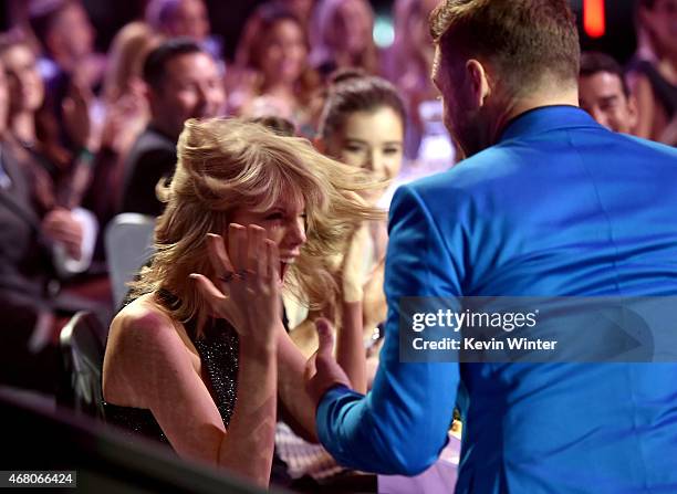 Singer/songwriter Taylor Swift reacts to winning the Best Lyrics award for 'Blank Space' with singer Justin Timberlake in the audience during the...