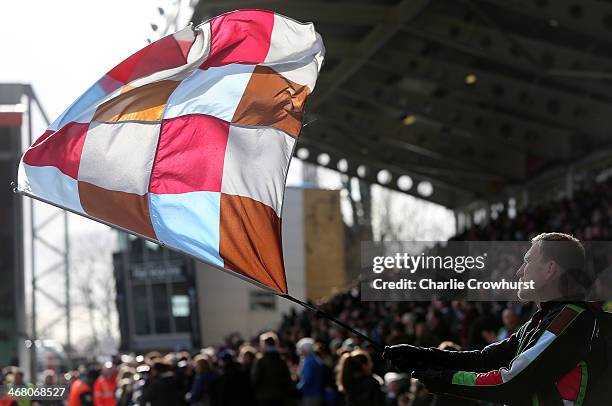 Quins fan waves his flag during the Aviva Premiership match between Harlequins and London Wasps at Twickenham Stoop on February 09, 2014 in London,...