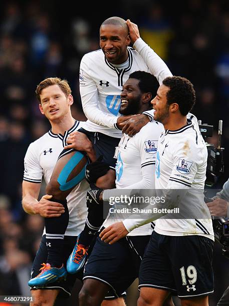 Jermain Defoe of Tottenham Hotspur is carried on the shoulders of team mates Jan Vertonghen and Emmanuel Adebayor at the end of his final home game...