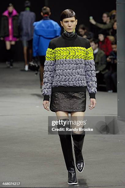 Model walks the runway at the Alexander Wang during Mercedes-Benz Fashion Week Fall 2014 at the Duggal Greenhouse on February 8, 2014 in the Brooklyn...