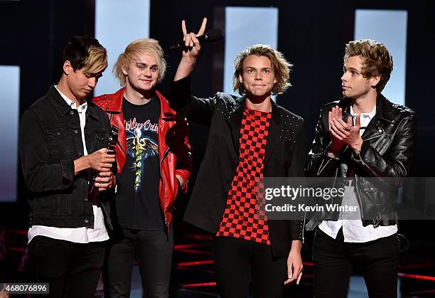 Musicians Calum Hood, Michael Clifford, Ashton Irwin, and Luke Hemmings of 5 Seconds of Summer accept the Best Fan Army award onstage during the 2015...