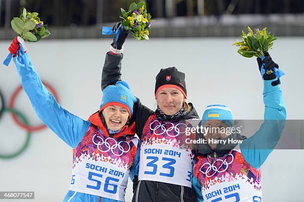 Silver medalist Olga Vilukhina of Russia, gold medalist Anastasiya Kuzmina of Slovakia and bronze medalist Vita Semerenko of Ukraine pose during the...