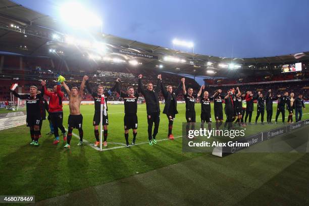 Players of Augsburg celebrate after the Bundesliga match between VfB Stuttgart and FC Augsburg at Mercedes-Benz Arena on February 9, 2014 in...