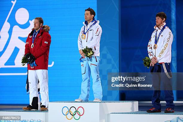 Silver medalist Dominik Landertinger of Austria, gold medalist Ole Einar Bjoerndalen of Norway and bronze medalist Jaroslav Soukup of the Czech...