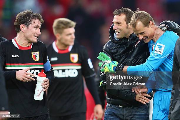 Head coach Markus Weinzierl of Augsburg celebrates with goalkeeper Alexander Manninger and Paul Verhaegh after the Bundesliga match between VfB...