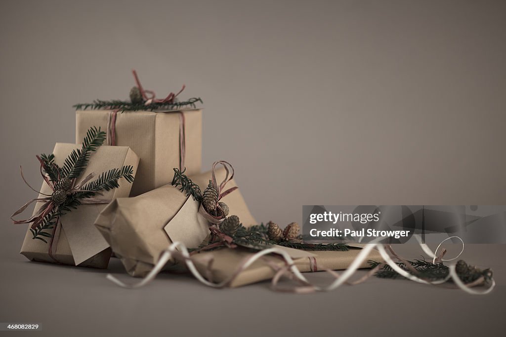 Christmas presents, wrapped in brown paper.