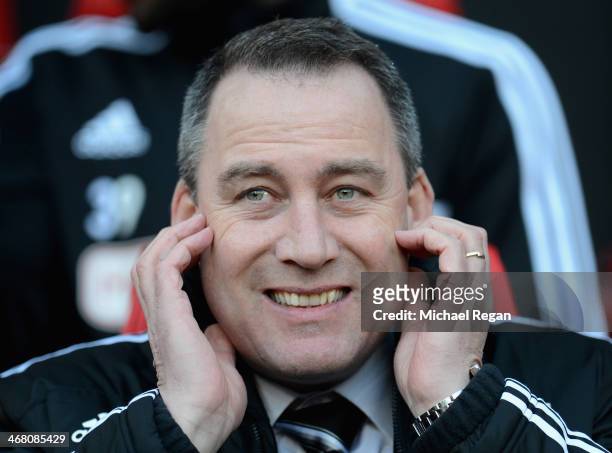 Fulham Manager Rene Meulensteen looks on prior to the Barclays Premier League match between Manchester United and Fulham at Old Trafford on February...