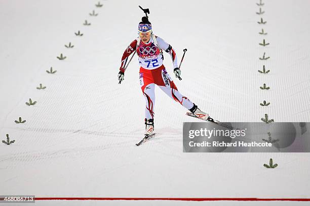 Yuki Nakajima of Japan cross the finish line in the Women's 7.5 km Sprint during day two of the Sochi 2014 Winter Olympics at Laura Cross-country Ski...