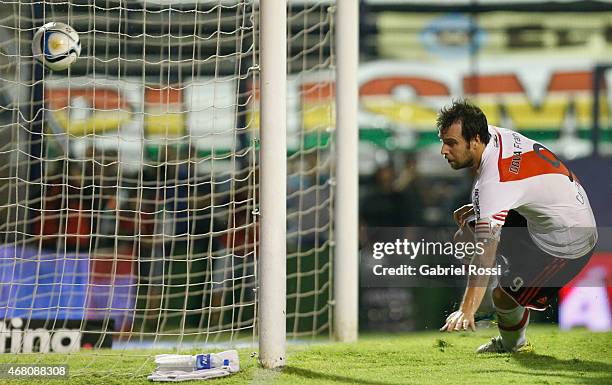 Fernando Cavenaghi of River Plate kicks the ball to score the first goal of his team during a match between Gimnasia y Esgrima La Plata and River...